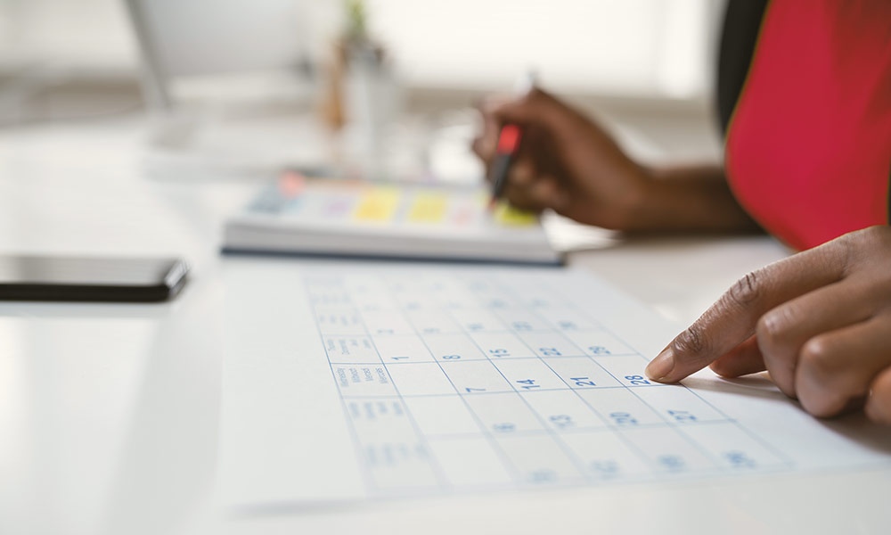 Woman looking at calendar