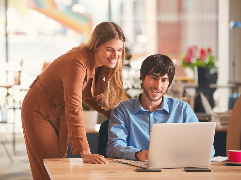 People working on computer together