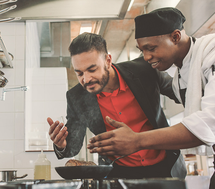 Restaurant owner working with chef