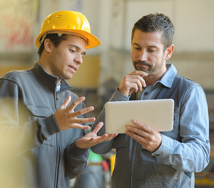 Business owner working with employee